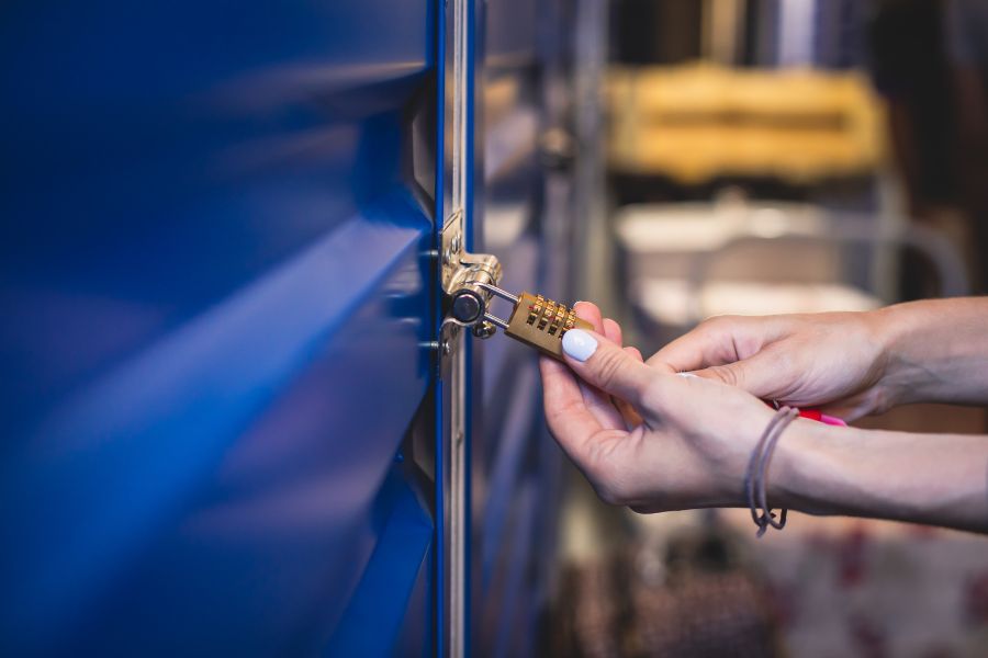 A person adding additional locks to a garage door